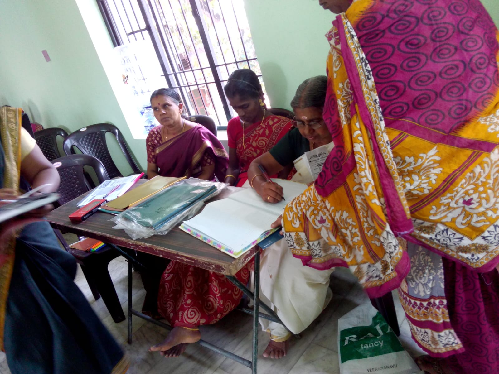 Distributing sarees and clothing to women at our Clothing Distribution Event, 2024