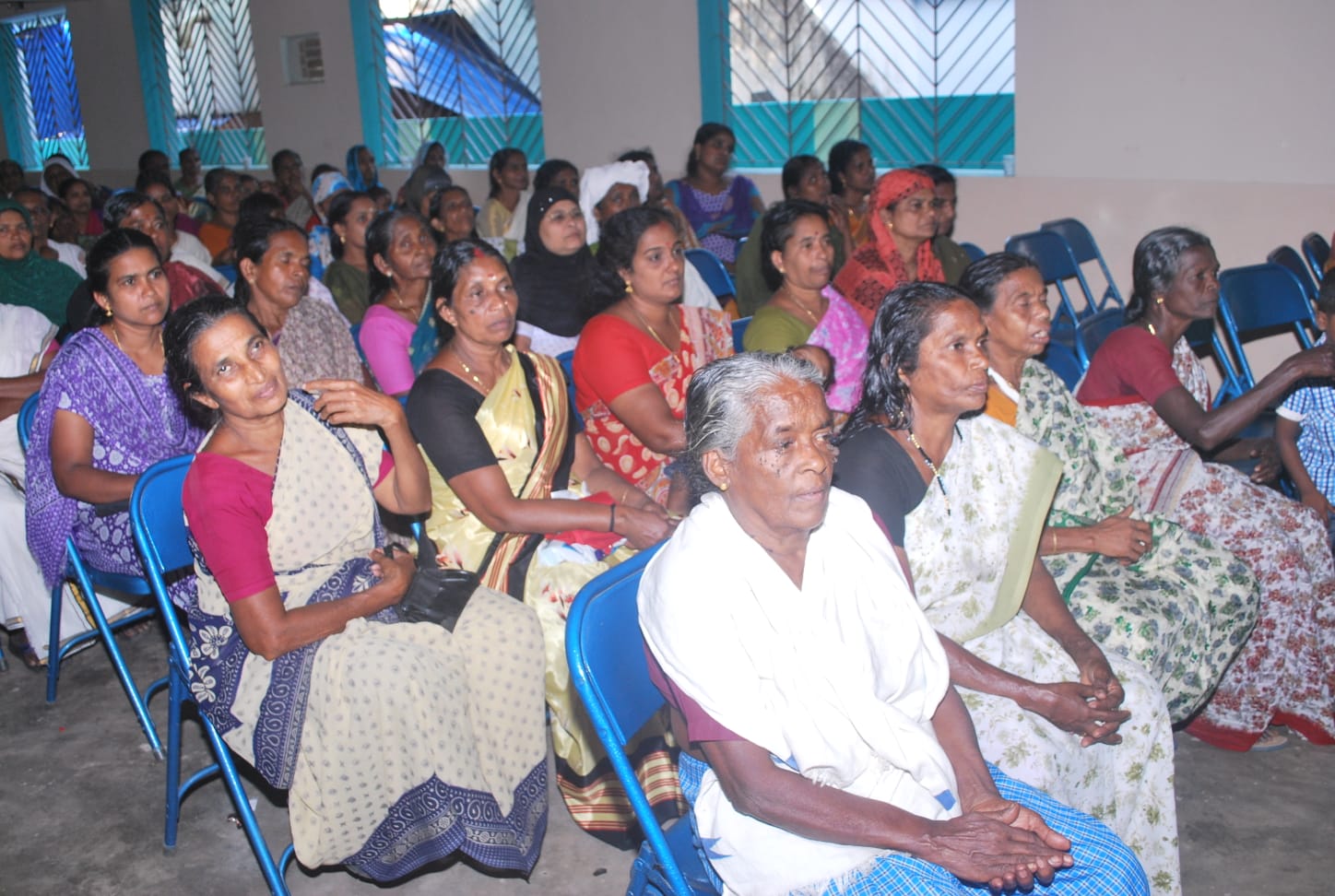 Delivering rice and wheat to households during a Food Distribution Drive in Thiruvananthapuram